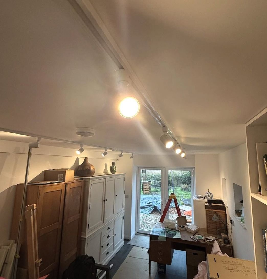 Track spotlights in a garden studio
